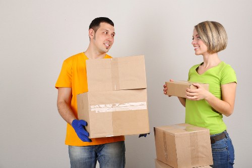 Packed household boxes ready for collection with mobile storage